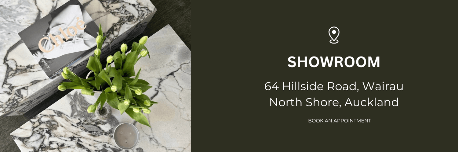 Natural Stone Co showroom banner with marble display, flowers, and address details for the Wairau, North Shore Auckland showroom.